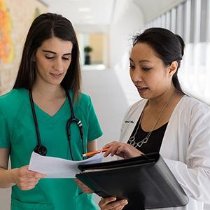 Two healthcare professionals having a conversation