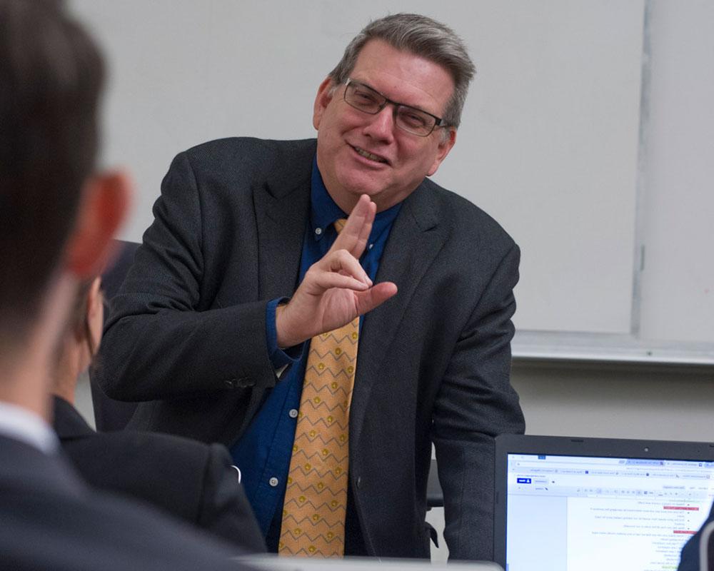 Professor speaking with students