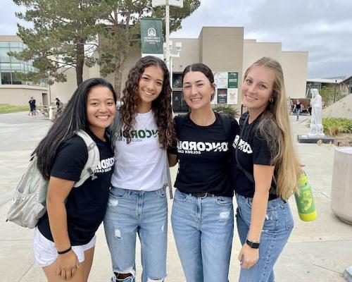 Four girls smiling for a photo